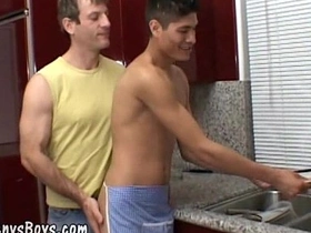Young Asian twink gives blow job to a older daddy