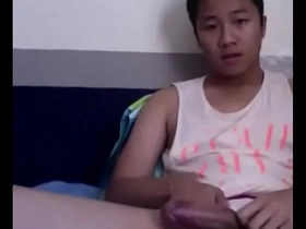 Asian boy with a big cock shows off his skills