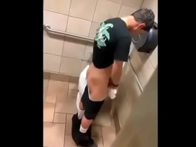 Gay restroom action with a hot twink