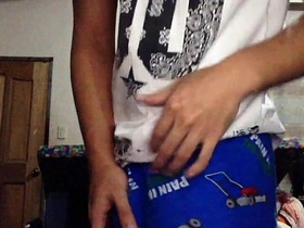 Young Asian man masturbates.