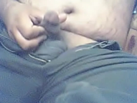 Dark-haired guy gives himself a hand job.