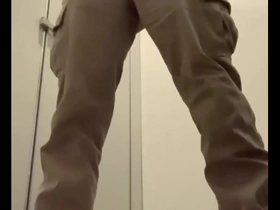 Man pleasuring himself and ejaculating while standing at the toilet.